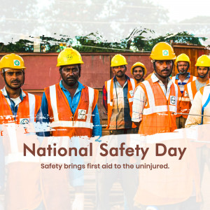 Group of construction workers wearing hard hats and safety vests on National Safety Day