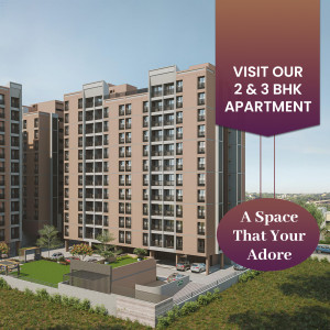 Modern apartment building with advertisement for 2 & 3 BHK apartments