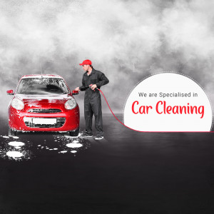 A man washing a red car with a high-pressure hose.