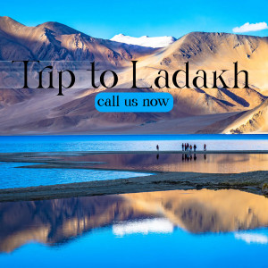 Scenic view of Pangong Tso lake in Ladakh with mountains and text 'Trip to Ladakh, call us now'