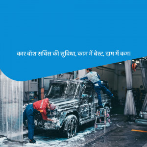 Two car wash professionals cleaning a white SUV with foam.