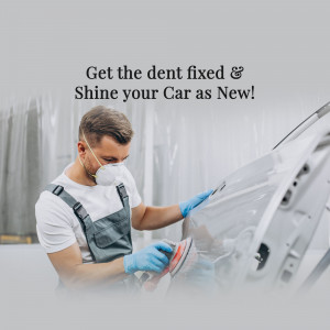 A mechanic repairing a dent on a silver car.