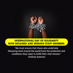 Hands bound in chains with a message about solidarity with detained and missing staff members.