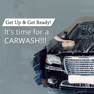 A person washing a black car with a sponge.