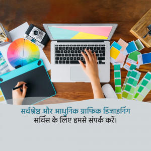 Laptop, tablet, color swatches, and design tools on a wooden desk