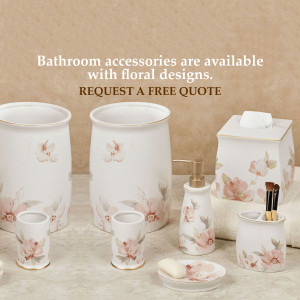 White bathroom accessories with delicate floral designs