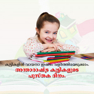 A cute little girl smiling while sitting at a desk with a stack of colorful books.