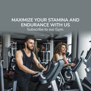 Man and woman working out on elliptical machines in a gym.
