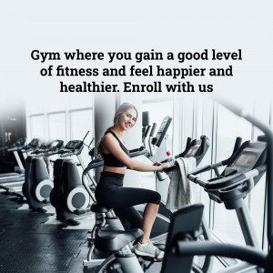 Woman exercising on an elliptical machine in a modern gym.