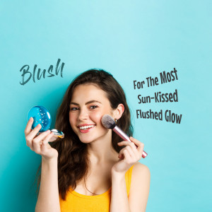 Woman applying blush with a makeup brush