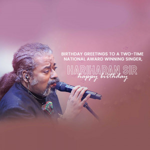 Hariharan, a renowned Indian singer, performing on stage with a microphone.