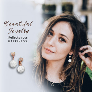 Woman wearing pearl earrings with text overlay 'Beautiful Jewelry Reflects your Happiness'