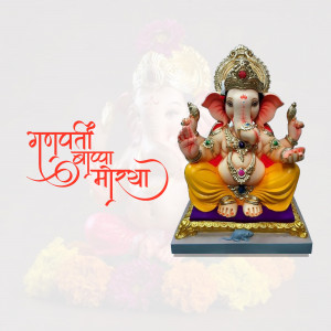 A beautifully decorated idol of Lord Ganesha with the text 'Ganpati Bappa Morya' in Marathi.