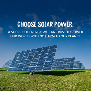 Solar panels in a field with blue sky and clouds