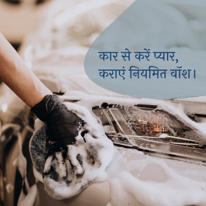 A person washing a car with foam and a sponge.