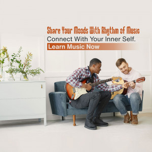Two men learning to play guitar in a living room setting.