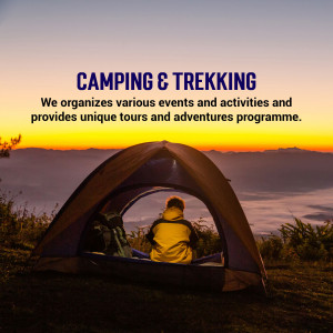 A person sitting inside a tent looking at a mountain sunrise.