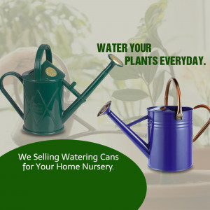Green and blue watering cans with plants in the background