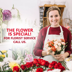Florist holding a bouquet of flowers in her shop