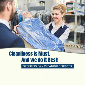 A dry cleaning employee handing a garment in a plastic cover to a customer.