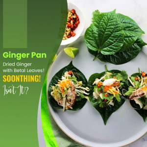 Close-up of Ginger Pan, a Thai appetizer with betal leaves, dried ginger, and a savory filling.