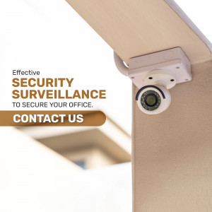 Security camera mounted under an office ceiling