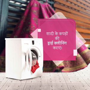 Washing machine with a red garment inside and a banner in Hindi promoting dry cleaning for wedding clothes.
