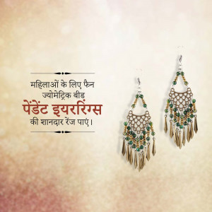 Close-up of ornate silver and green earrings with tassels