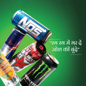 A stack of various energy drink cans against a green background with text in Hindi.
