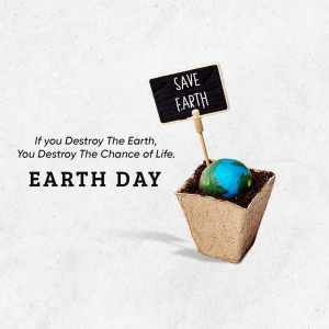 A small Earth globe planted in a pot with a 'Save Earth' sign.