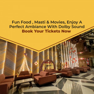 Interior view of a modern movie theater with comfortable seating and Dolby sound system.