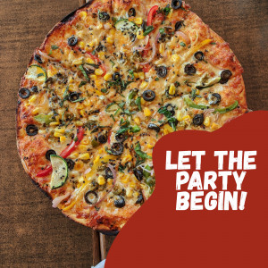 A close-up of a vegetable pizza with olives, corn, peppers, and zucchini, with a red banner that says 'LET THE PARTY BEGIN!'