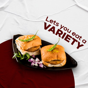 Close-up of two Vada Pavs on a black plate with red and white background