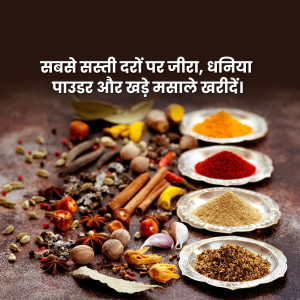 A vibrant display of various Indian spices on a dark wooden surface.