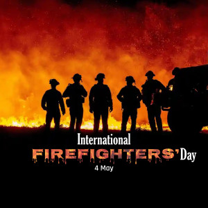 Silhouetted firefighters standing in front of a large fire with text 'International Firefighters' Day - 4 May'