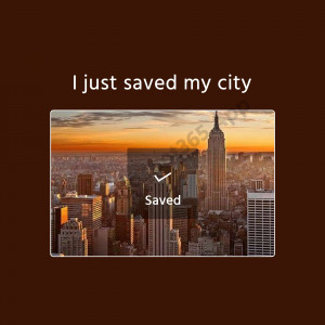 New York City skyline with a 'Saved' notification overlay