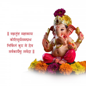 Close-up of a beautifully decorated Lord Ganesha idol with flowers and traditional attire.