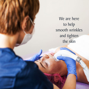 A dermatologist performing a facial treatment on a patient.