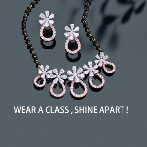 Close-up of a diamond mangalsutra and earrings set on a dark background