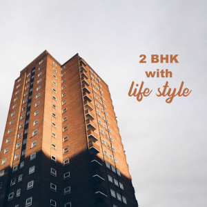 Modern apartment building with text overlay '2 BHK with lifestyle'