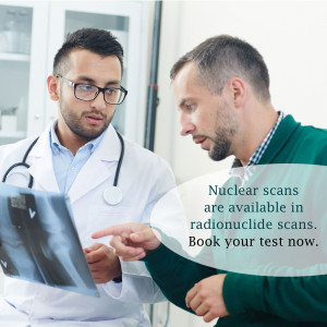 Two doctors discussing a patient's X-ray scan in a medical facility.