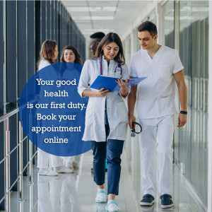 Two doctors walking down a hospital hallway with a promotional message.
