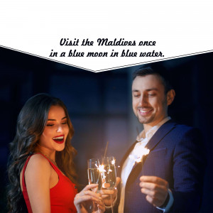 Couple toasting with champagne in the Maldives