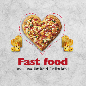 A heart-shaped pizza with chicken nuggets, promoting fast food.