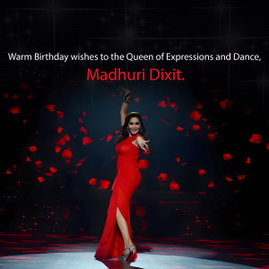 Madhuri Dixit in a red dress with falling rose petals