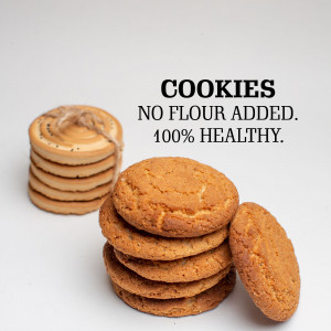 Stack of no-flour cookies with text 'COOKIES NO FLOUR ADDED. 100% HEALTHY.'