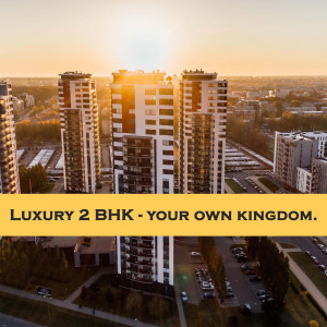 Modern apartment buildings at sunset with text overlay 'Luxury 2 BHK - Your Own Kingdom'