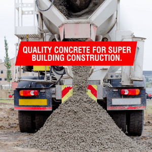 Rear view of a concrete mixer truck pouring concrete.