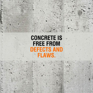 Concrete wall with text stating 'Concrete is free from defects and flaws'