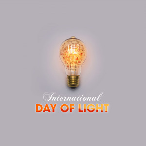 Glowing light bulb with text 'International Day of Light'